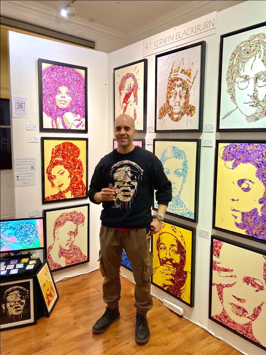Kerwin Blackburn with his pop art paintings on display at Roy's Art Fair, Oxo Tower London, November 2021 | By Kerwin