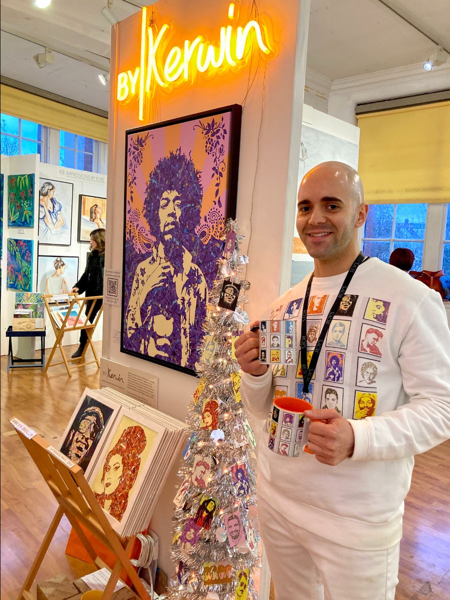Kerwin Blackburn with his pop art paintings on display at Roy's Art Fair, Oxo Tower London, November 2021 | By Kerwin