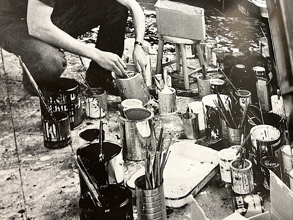 Jackson Pollock with his paints