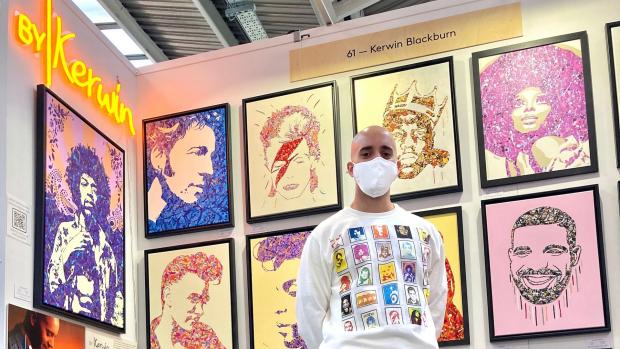 UK pop art Kerwin Blackburn with his Jackson Pollock-inspired music paintings at a previous exhibition in London