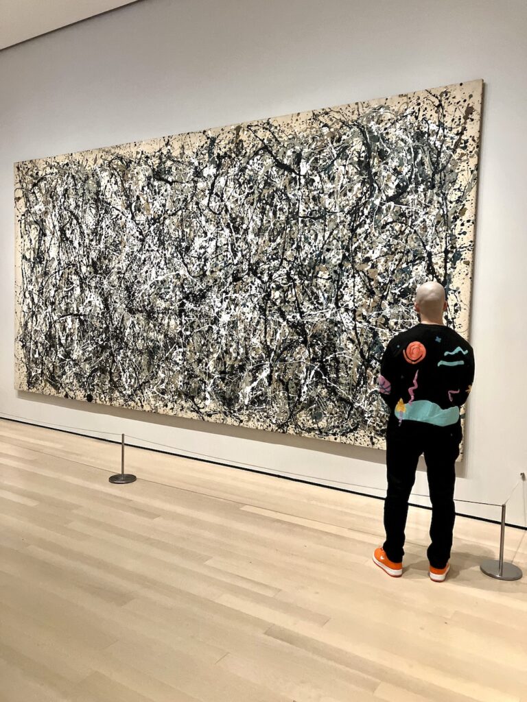 Kerwin next to a large original Jackson Pollock action painting at the Museum of Modern Art, New York City | MoMA