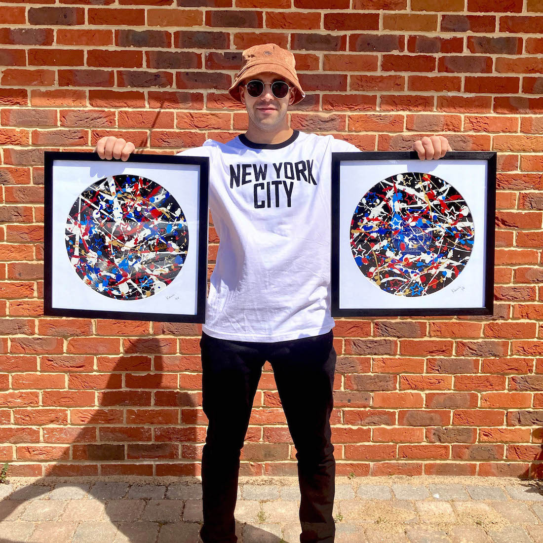 Kerwin with his painted USA-themed vinyl records ready for his New York art exhibition in 2022 | By Kerwin | Jackson Pollock style art