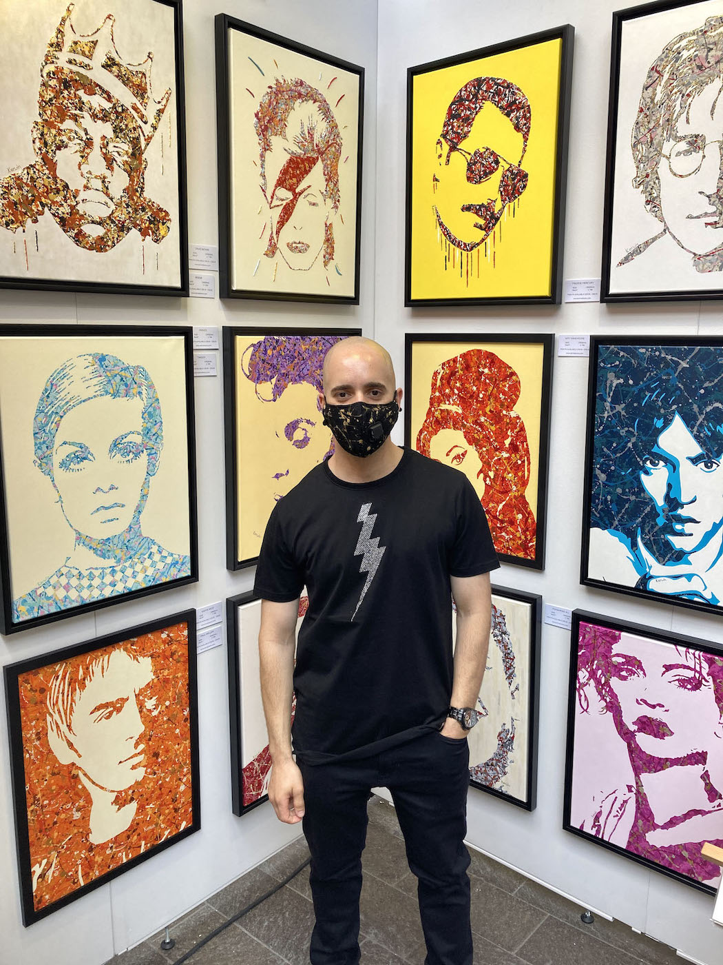 UK artist Kerwin Blackburn exhibiting his pop art paintings at The Other Art Fair, London - wearing an Elvis TCB lightning bolt t-shirt | By Kerwin | July 2021