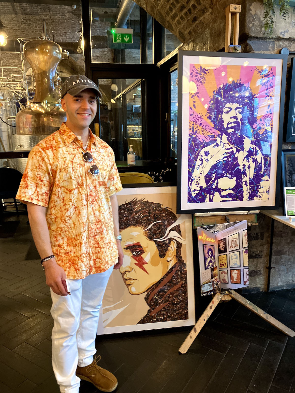 Kerwin Blackburn with a Jimi Hendrix print at a fundraiser art night for the NSPCC in Manchester, June 2023