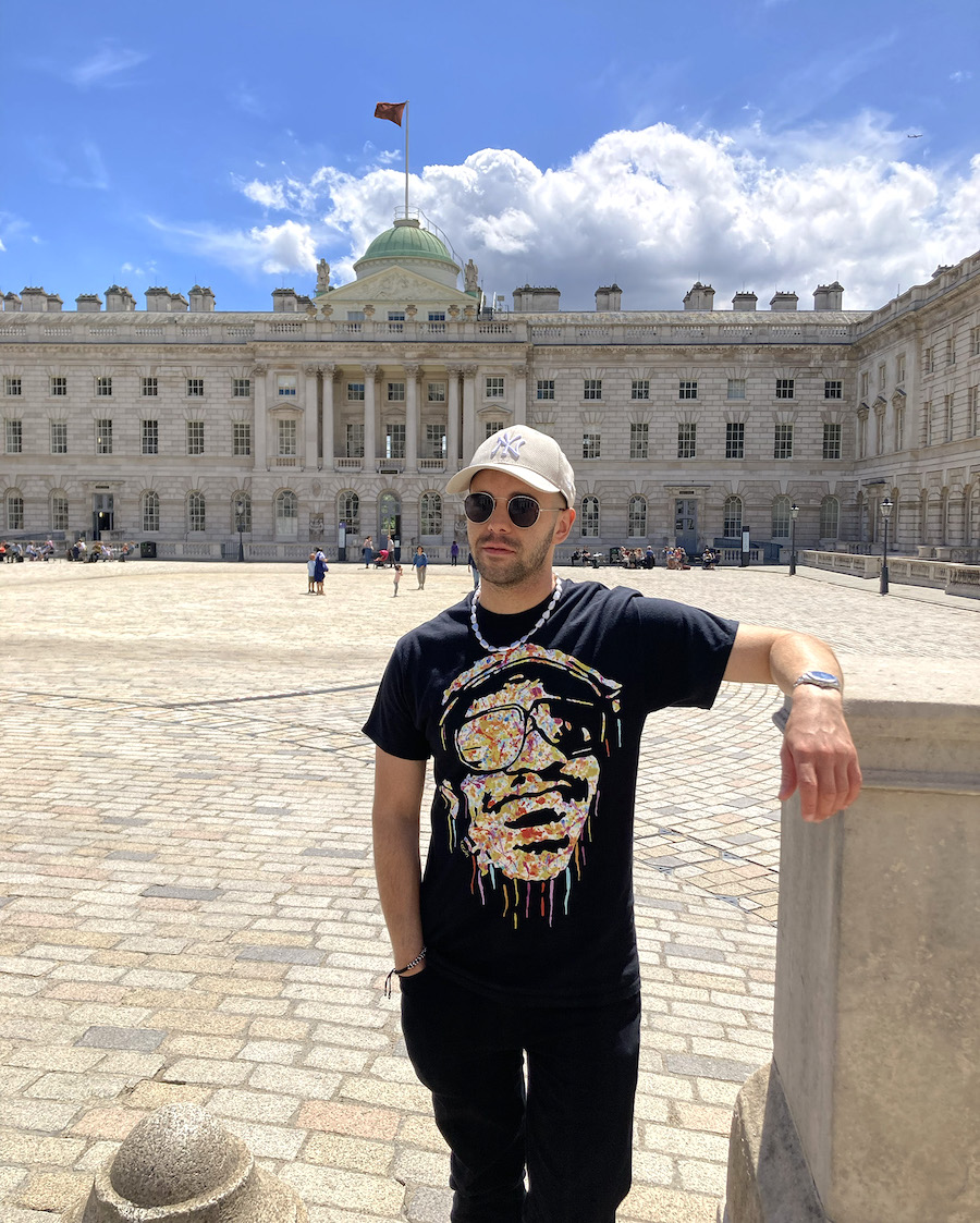 Kerwin Blackburn wearing his Stevie Wonder painting t-shirt at Somerset House - where he also went to university at King's College London