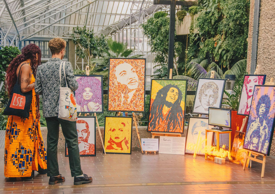 Kerwin Blackburn exhibits his By Kerwin pop art music paintings at the Barbican Centre Conservatory in London, July 2021