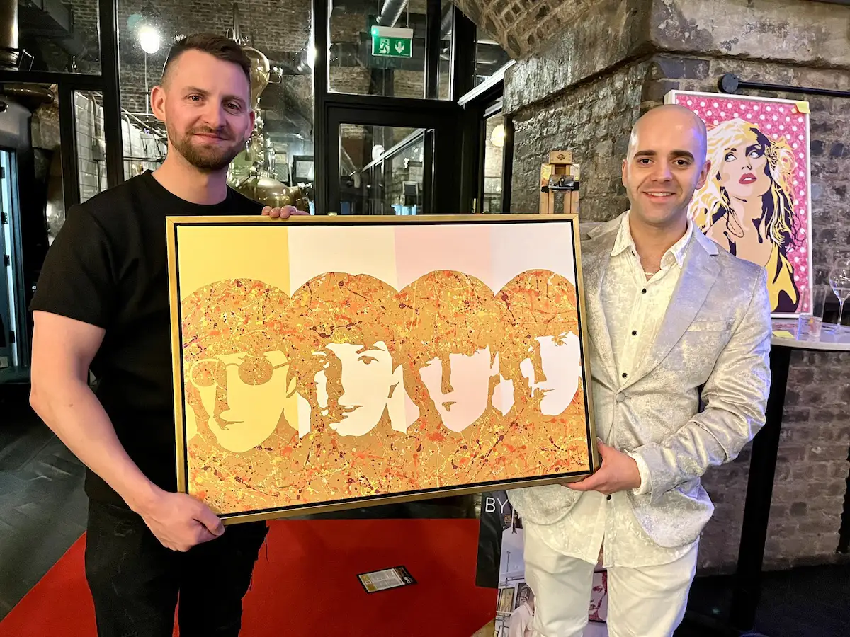Kerwin with his The Beatles print that went to a new home at the NSPCC Manchester fundraiser